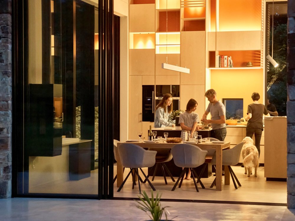 Rénovation d'une maison en pierres en Isère (38) avec l'installation de coulissants minimalistes