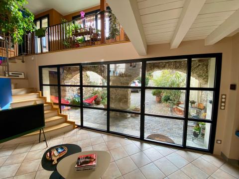 Projet aménagement intérieure grâce à l'installation d'une verrière sur-mesure dans une maison en pierre voûtée dans le Rhône (69)